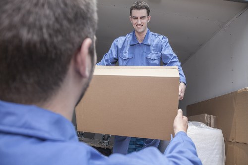 Movers loading boxes for a home removal in Bow
