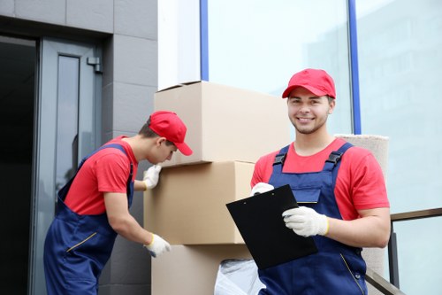 Furniture and boxes being transported by a Bow man and van service