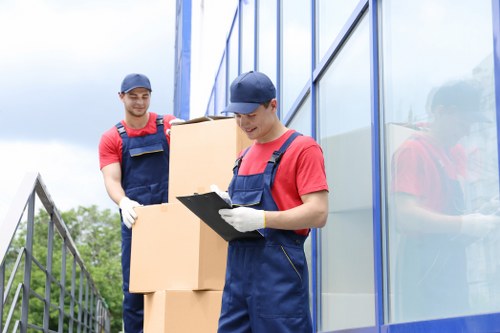 Removal team preparing equipment and assessing safety before a move