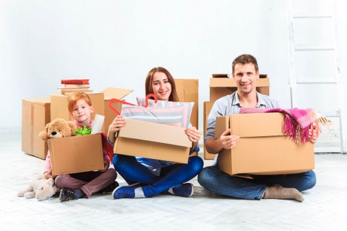 Packed boxes and furniture ready for a Bow house move