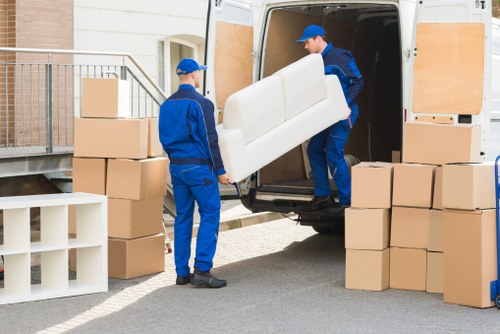 Removal van and moving boxes for a house move in Bow