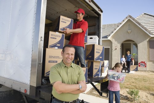 Removal van positioned near a Bow property with narrow street access