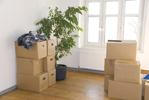 Boxes and furniture arranged in a new Bow property