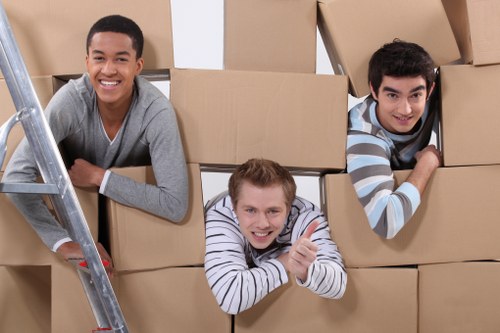 Removal van and moving team in a Bow street setting