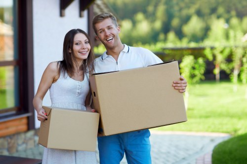 Careful furniture handling during a house move in Bow