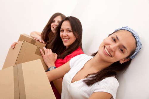 Moving crew handling apartment access near Bow