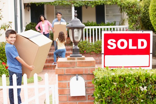 Packing boxes and furniture ready for a Bow house move
